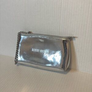 Bobbi Brown silver metallic wristlet